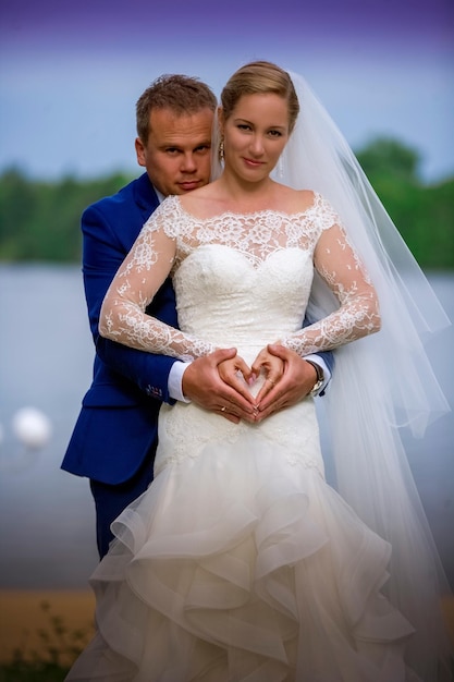 Portrait of a smiling young couple standing outdoors