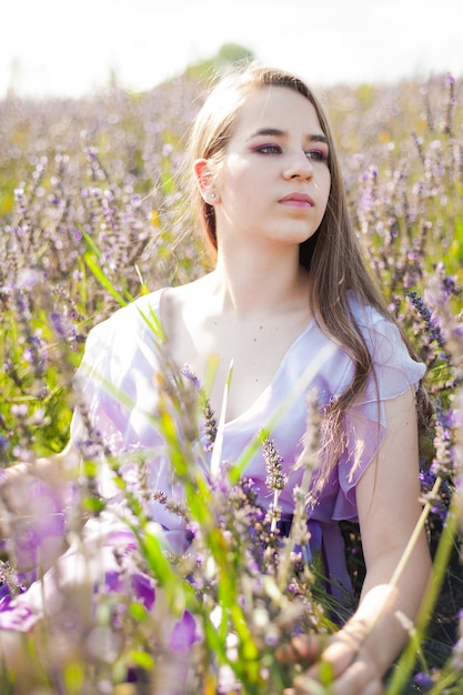 Portrait of smiling young european  woman on the lavender field