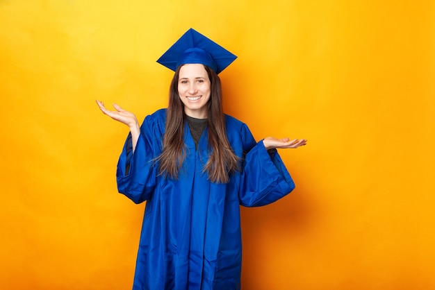 Portrait of smiling young graduating woman dont know what to do after graduate