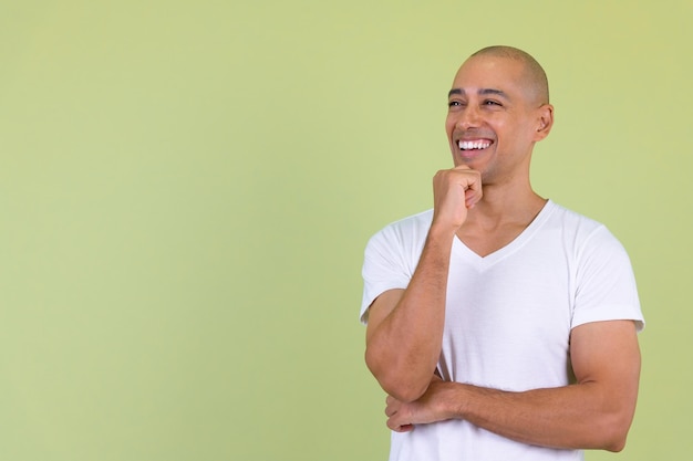 Portrait of a smiling young man against gray background