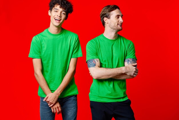 Portrait of a smiling young man against red background