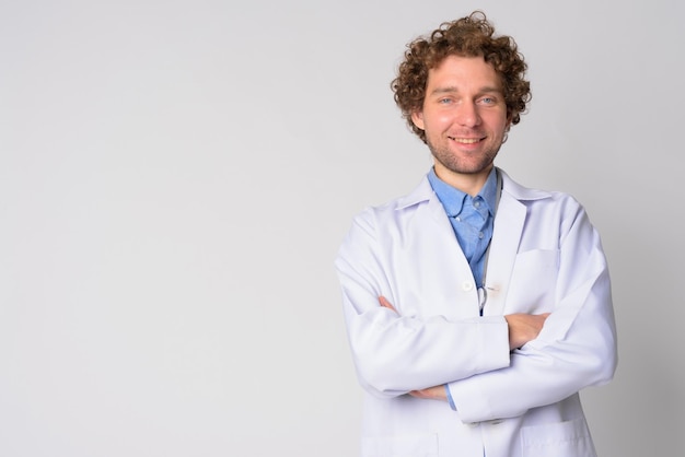 Portrait of smiling young man against white background