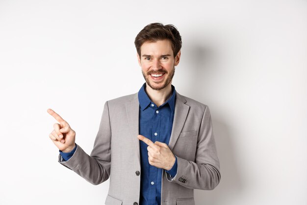 Portrait of smiling young man against white background