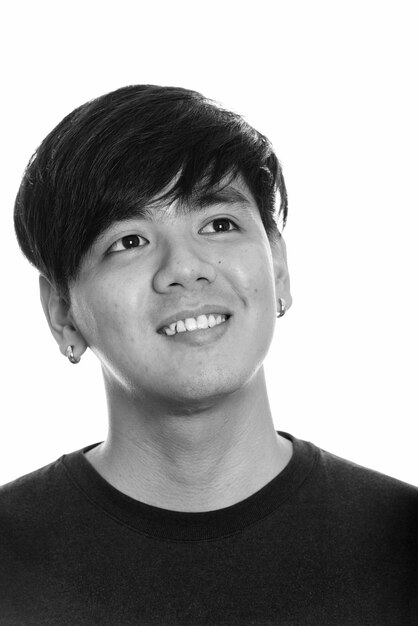 Portrait of a smiling young man against white background