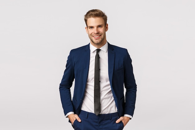 Portrait of a smiling young man against white background