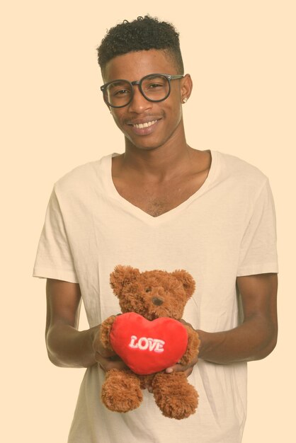 Portrait of smiling young man against white background