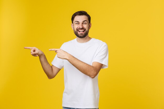 Portrait of a smiling young man against yellow background