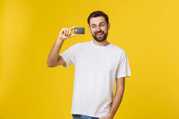 Portrait of a smiling young man against yellow background