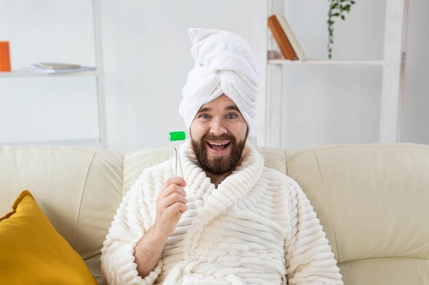 Portrait of smiling young man at home