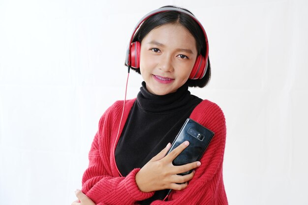 Portrait of smiling young man using mobile phone