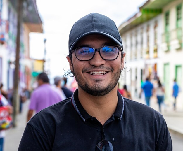 Portrait of smiling young man wearing cap