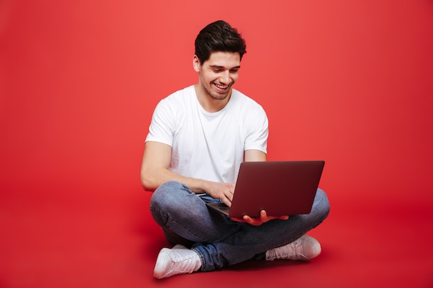 Portrait of a smiling young man in white t-shirt