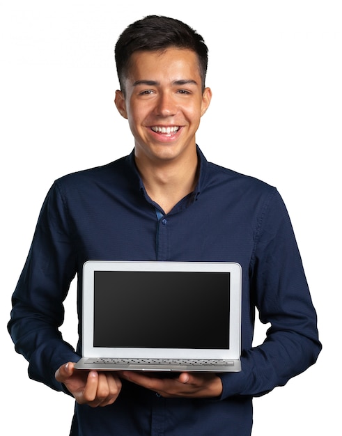 Portrait of smiling young man with laptop