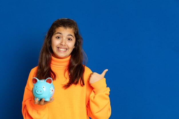 Portrait of a smiling young woman against blue sky