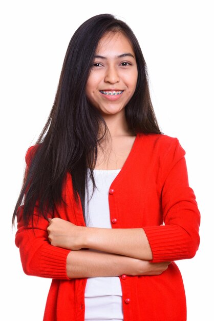 Portrait of a smiling young woman against white background