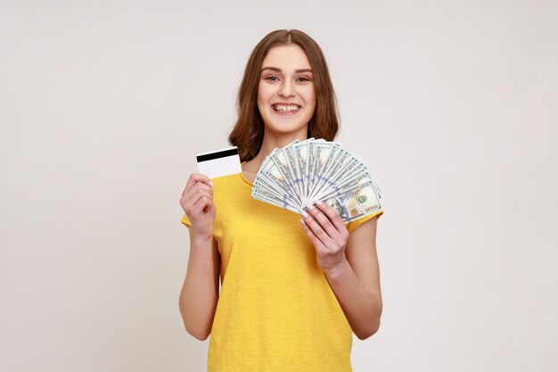 Portrait of a smiling young woman against white background