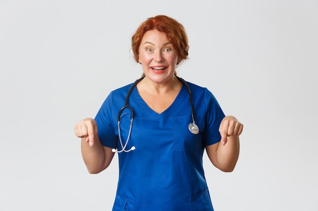 Portrait of a smiling young woman against white background