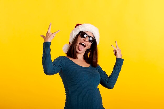 Portrait of a smiling young woman against yellow background