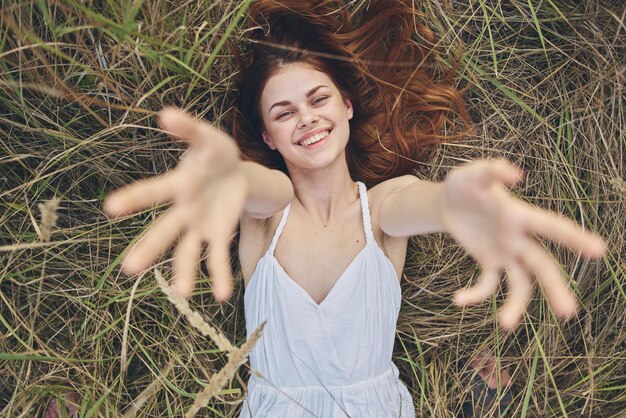 Portrait of a smiling young woman on field