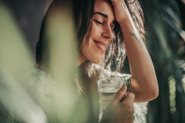 Portrait of a smiling young woman holding hands