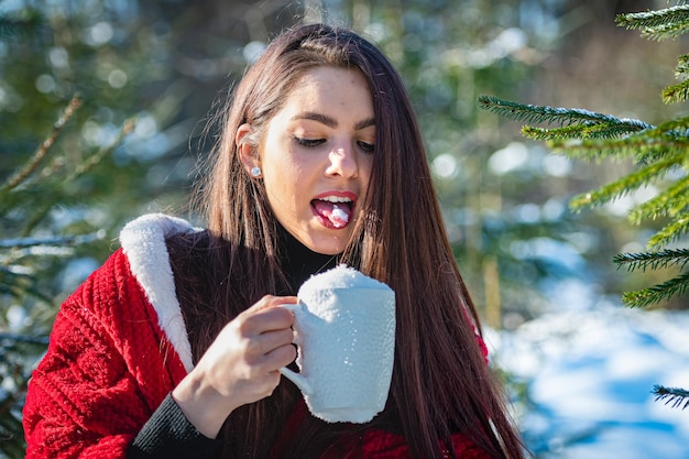 Portrait of smiling young woman holding ice cream