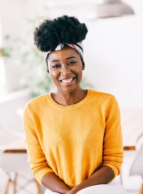 portrait of smiling young woman at home