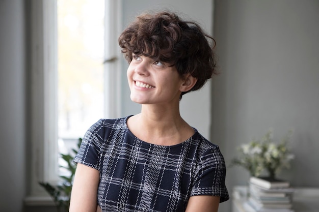 Portrait of smiling young woman at home