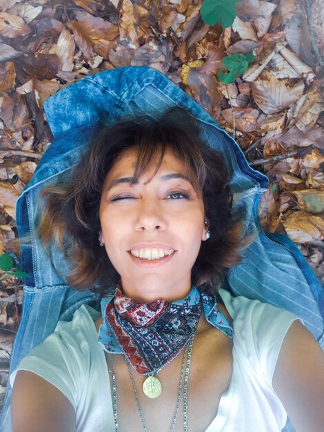 Portrait of a smiling young woman outdoors