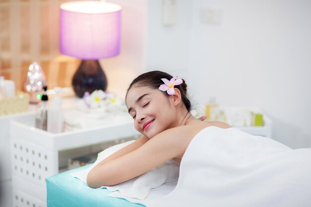 Portrait of a smiling young woman sitting at home