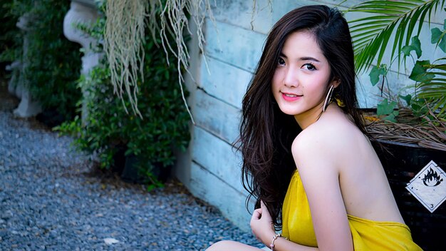 Portrait of smiling young woman standing outdoors