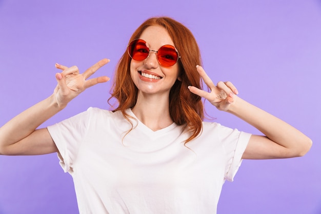 Portrait of a smiling young woman in sunglasses