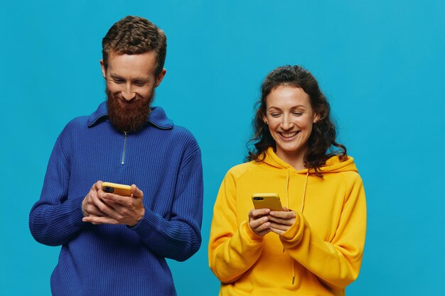 Portrait of smiling young woman using mobile phone