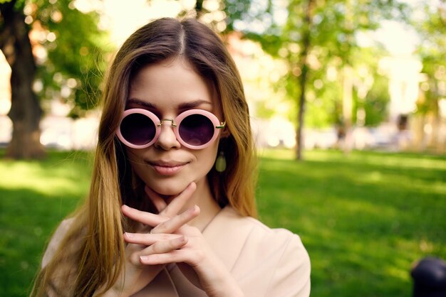 Portrait of smiling young woman wearing sunglasses