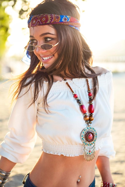 portrait of smiling young woman wearing sunglasses