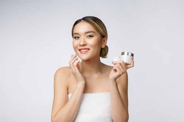 Photo portrait of a smiling young woman over white background