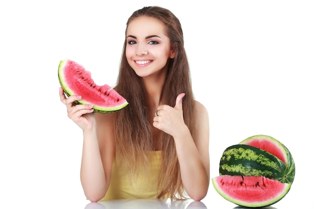 Portrait of a smiling young woman with watermelon isolated on white