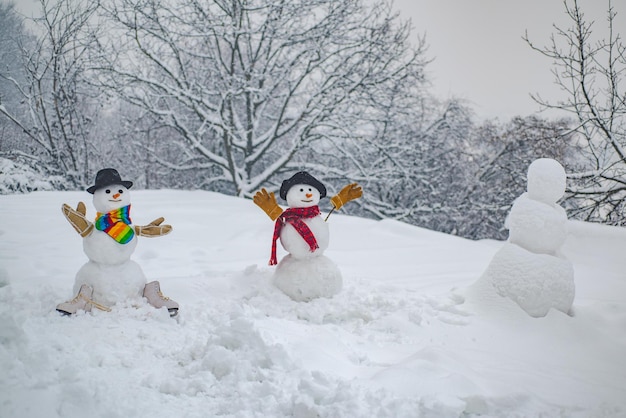 Portrait snowman in love Two Happy smiling snowman on sunny winter day Funny snowmen Theme Christmas