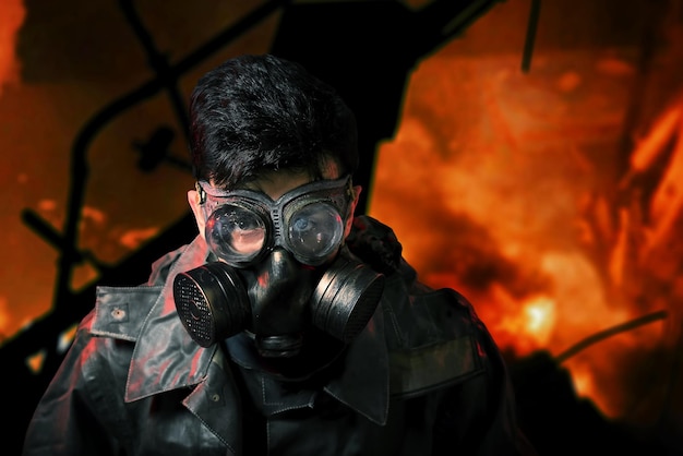 Portrait of soldier in chemical protection armor and gas mask