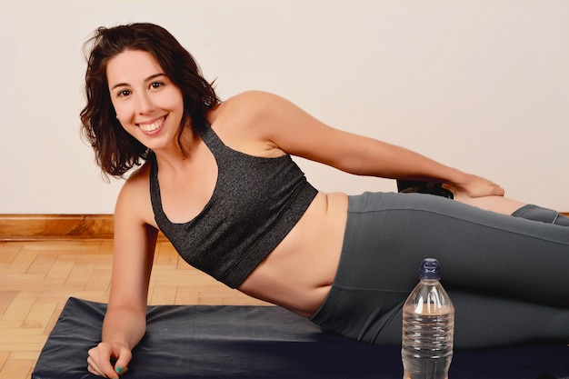 Portrait of sport woman streching legs