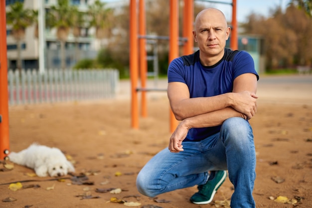 Portrait of a sporty man on the playground.