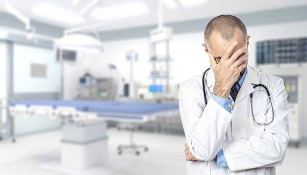 Portrait of a stressed doctor inside a hospital 