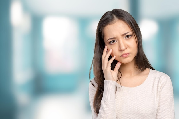 Portrait stressed sad young woman standing