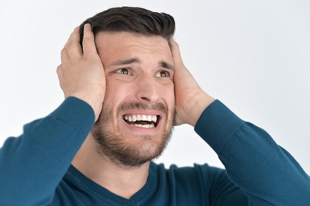 Portrait of a stressed young man close up