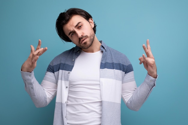 portrait of a strong brutal brunette man with a small beard