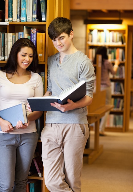 Portrait of students reading a book