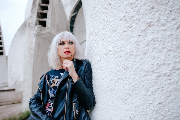 portrait of stylish blonde grunge young woman