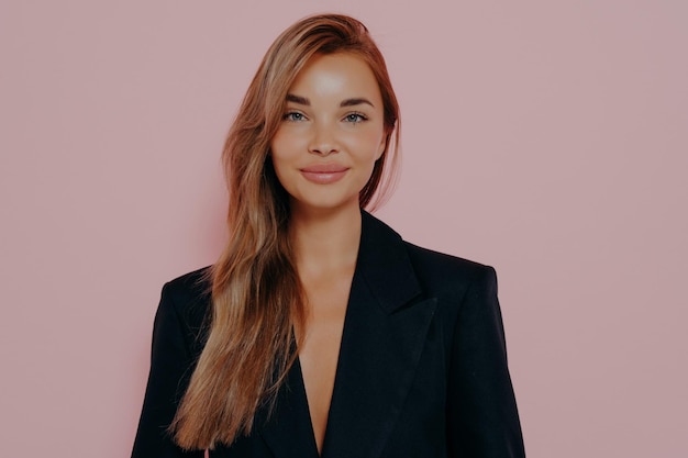 Portrait of stylish business woman with long stright hair wears black formal jacket