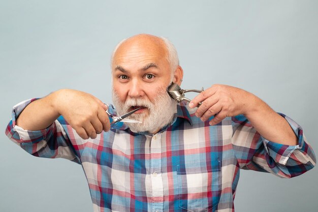 Portrait of stylish hairdresser bearded man with grey moustache beard bearded old man bearded male