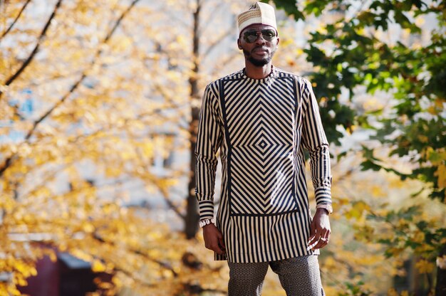 Portrait of stylish man at hat and sunglasses.