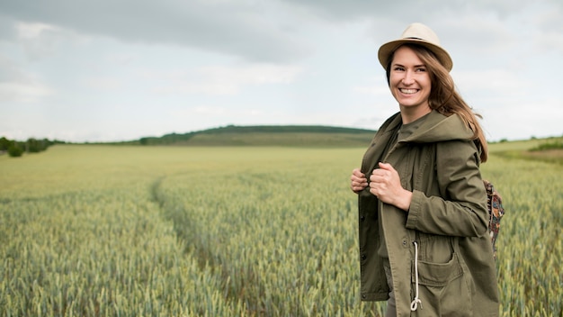 Portrait of stylish traveller posing outdoors